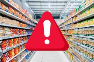 Corsia supermercato e simbolo attenzione