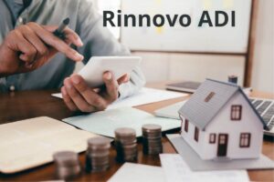 una persona che fa i conti e la scritta rinnovo ADI